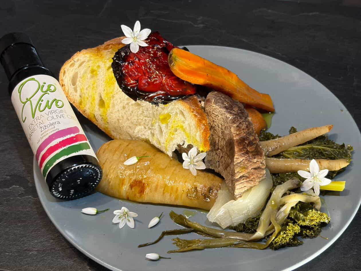 Art Brut Cuisine dish prepared by Outlaw Chef with olive oil and roasted vegetables